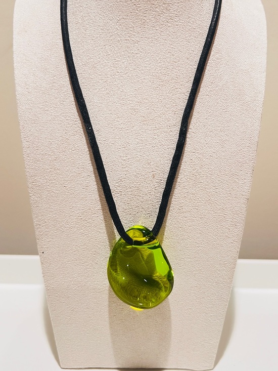 Baccarat Jewelry - Authentic Baccarat green crystal Galet pebble pendant on a black cord